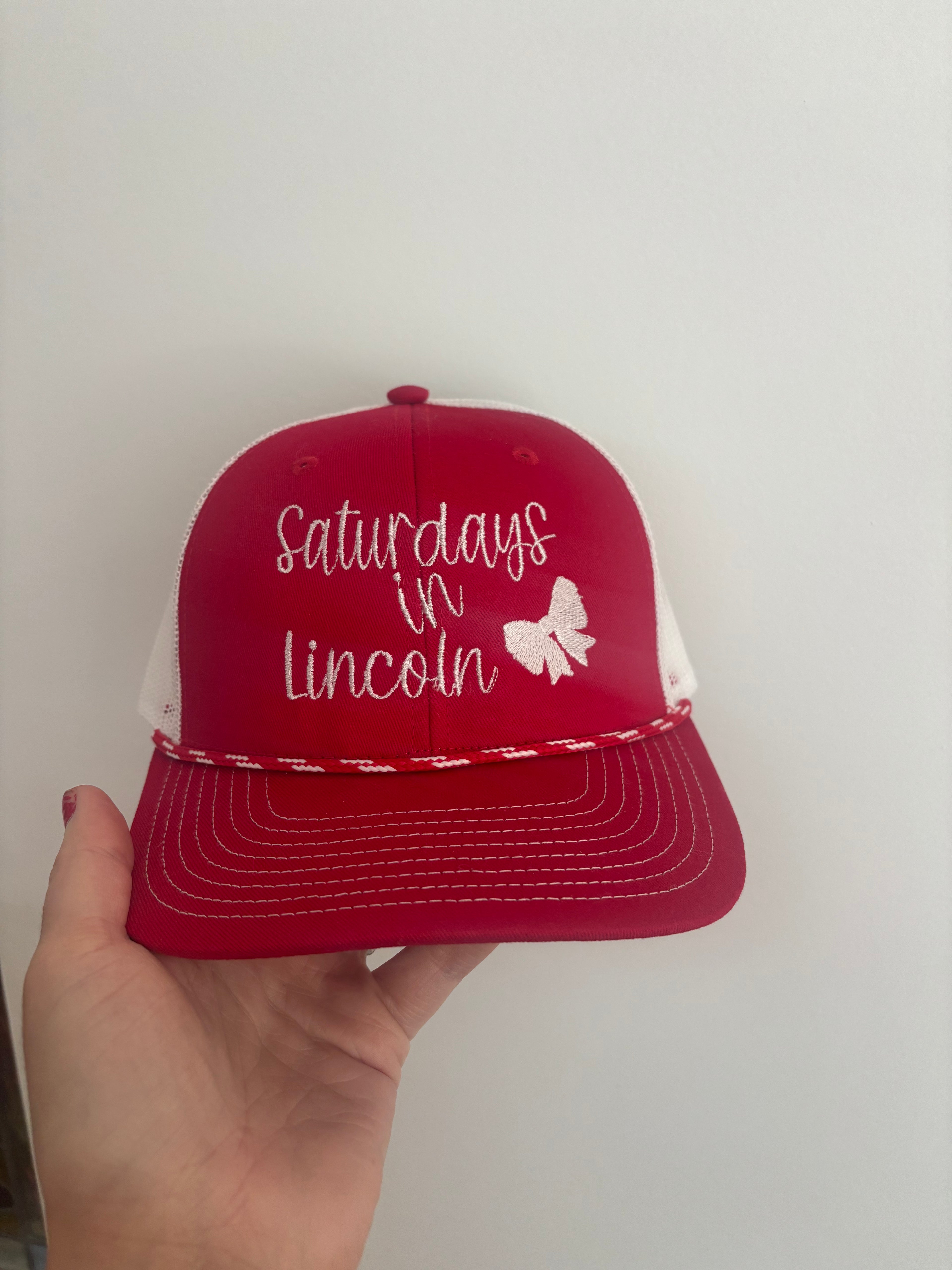 Saturdays in Lincoln Trucker Hat