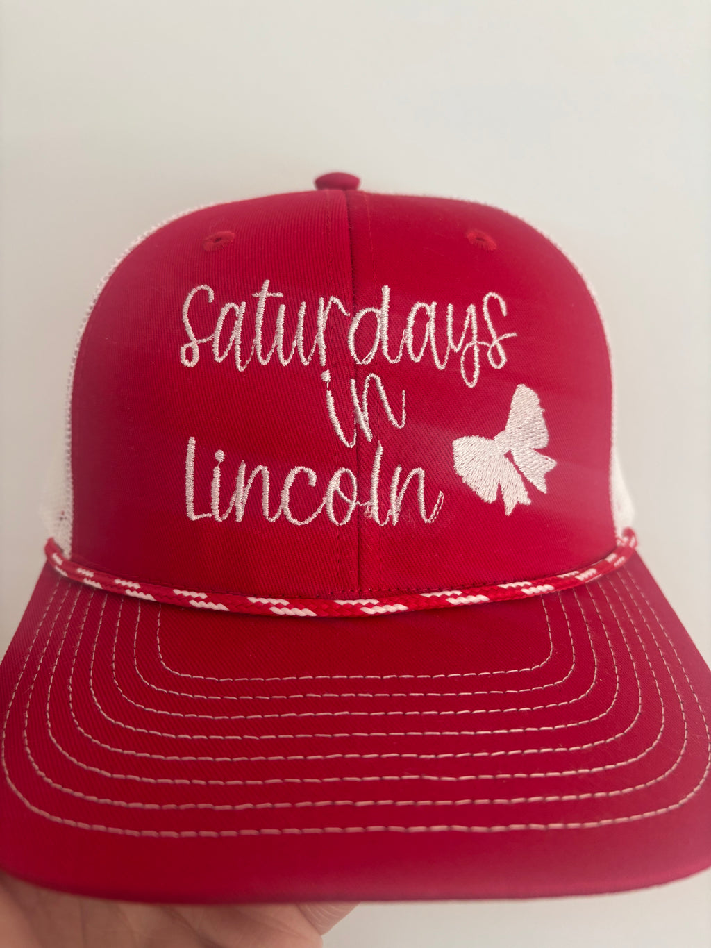 Saturdays in Lincoln Trucker Hat